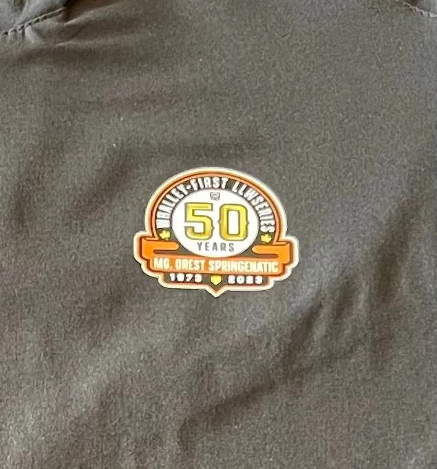 Black and Orange Cage Shirt with  WLL  50 year Logo